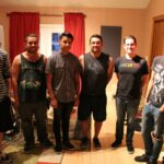 a group photo of the band cheribum in the tracking room of let down studio with john garcia and hector gomez in the picture.